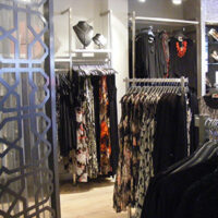 DSCF0096 A beautiful display adult evening-wear including dresses, jewellery and shoes in a Taking Shape shop with shop fittings and laser cut screen by Dymond Engineering